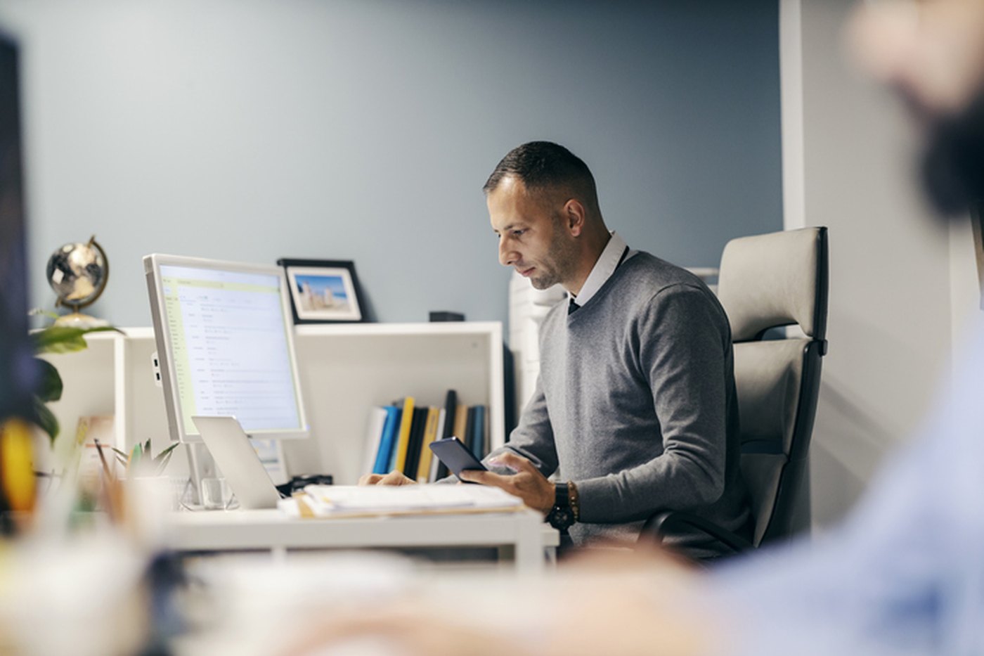A back-office finance team working at their desks in an open office